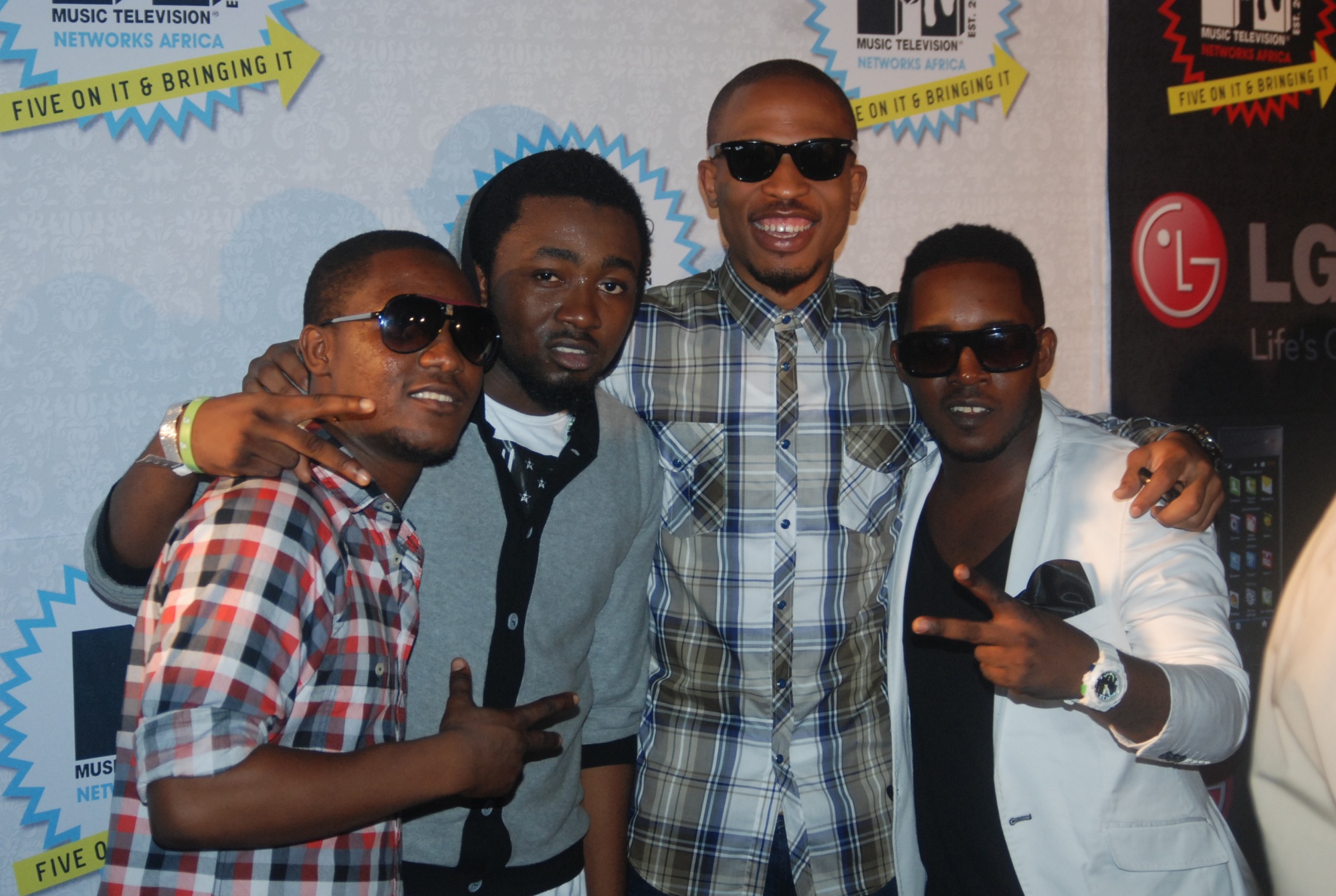 Jesse Jagz, IcePrince, and MI post for a photo with Naeto C in 2010.