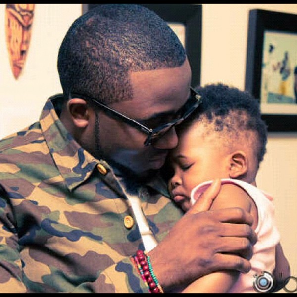 Mr Zamani hold his son in his arms