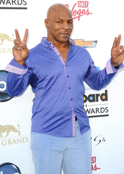 Peace and love Mike Tyson sends a message on the blue carpet at the 2013 Billboard Music Awards.