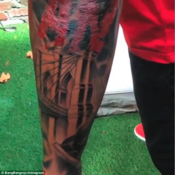 The Brooklyn Bridge adorns Henry's forearm