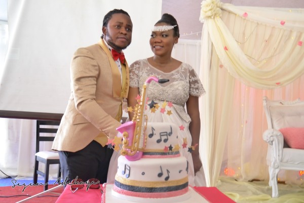 The couple cutting the wedding cake