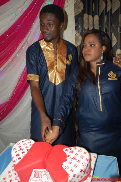 The couple cutting the wedding cake