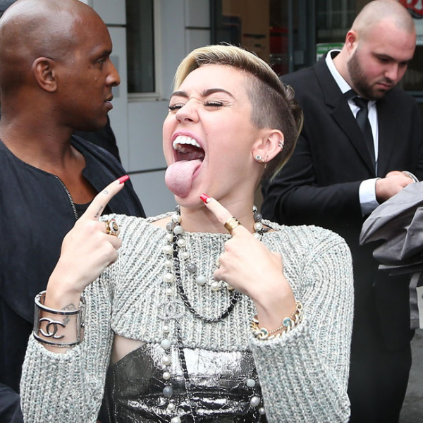 Miley Cyrus taking pictures with fans while arriving at NRJ studios in Paris. Paris, France September 9th 2013
