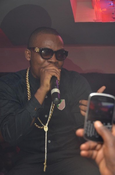 Olamide performing
