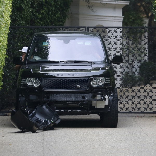 David Beckham backing up into his property after getting in a accident on front of his house as he was coming out of his drive way with his son in Los Angeles, California (part 1). Pictured: David Beckham and Brooklyn Beckham Ref: SPL639296 261013 Picture by: JD / Splash News Splash News and Pictures Los Angeles:310-821-2666 New York:212-619-2666 London: 870-934-2666 photodesk@splashnews.com