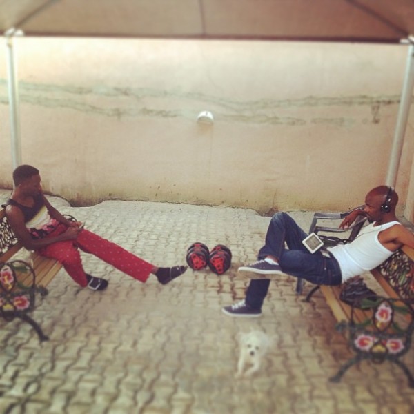 May D and his manager Raji Shehu cooling off at home