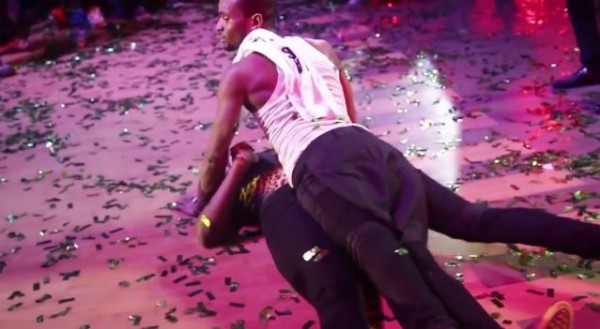 D'banj sitmulating sex with a female fan on stage. Photo: YouTube