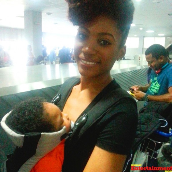Julius Agwu's wife Ibiere and song Zadok Chibuike Julius Agwu at the Murtala Mohammed International Airport, Lagos. Photo: Instagram
