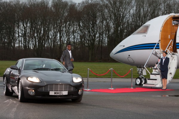 Mikel in front of his car.