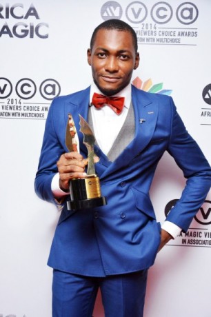 Tope Tedela poses with his Best Actor plaque