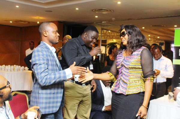 NECLive 2014 - Olumide Iyanda and Omotola pratice handshakes while Kwame muffles a laugh