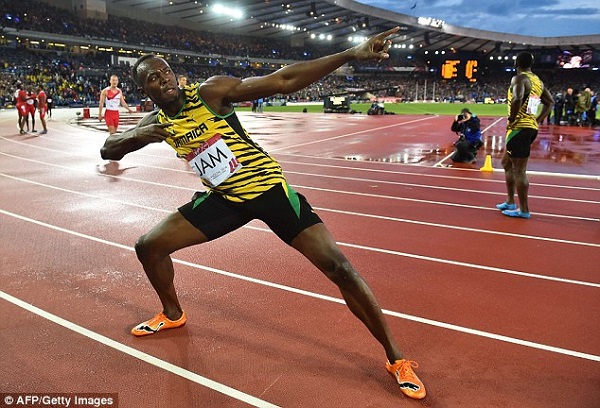 Bolt strikes the 'lightning' pose in Glasgow following his victory
