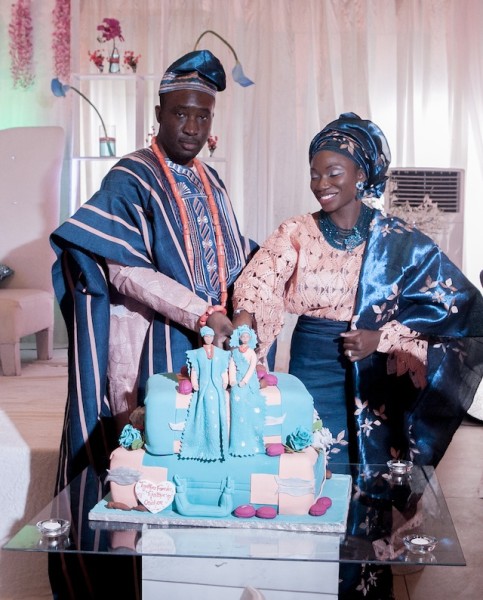 The couple with their wedding cake