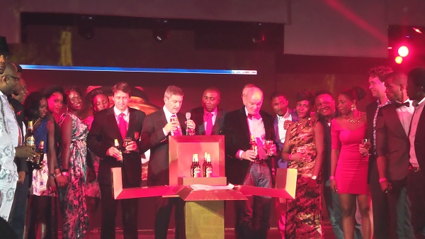 Nigeria Breweries executives unveils the new redefined bottles from the cube box. Photo: NET