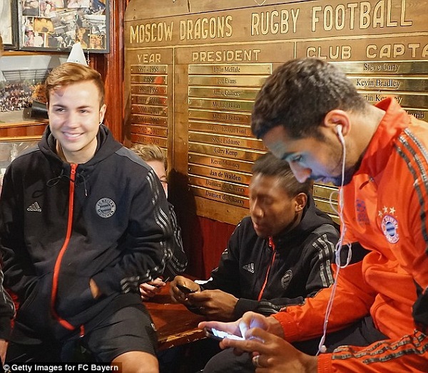 Mario Gotze, David Alaba and Mehdi Benatia seek shelter while spending more than an hour outside the hotel