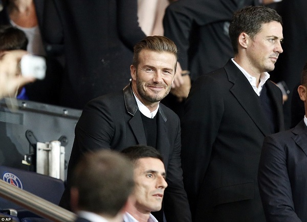Back in familiar surrounds, England and Manchester United legend Beckham enjoys the Champions League action