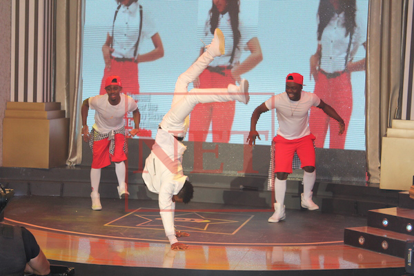 Tanzanian popular music act, Diamond, showing off his acrobatic skills while performing his hit single, 'Number One' at the opening of the BBHotshots