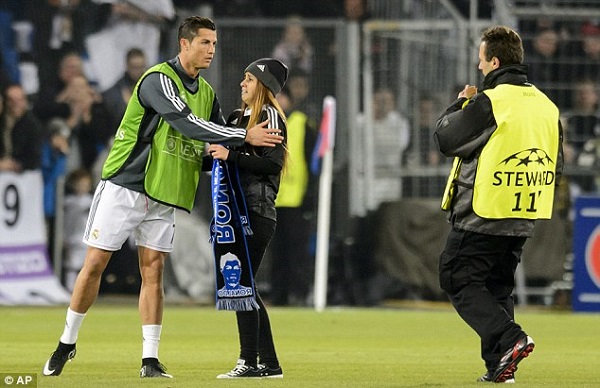 Ronaldo gives the fan a brief hug, who looked starstruck at meeting the 29-year-old