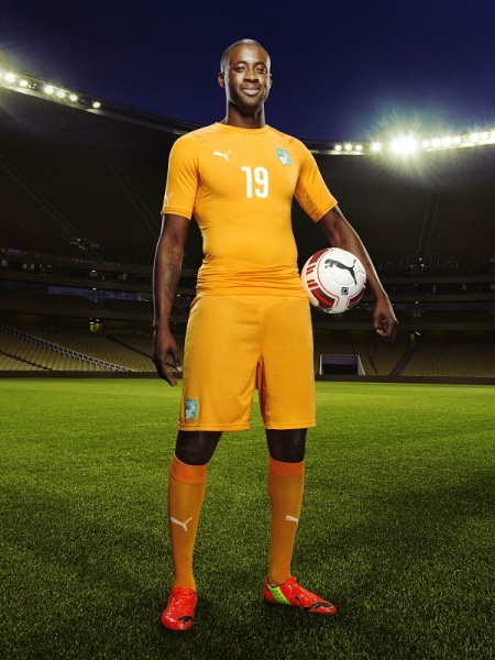 Yaya Touré in the 2014 Ivory Coast Home Kit that features PUMA's PWR ACTV Technology