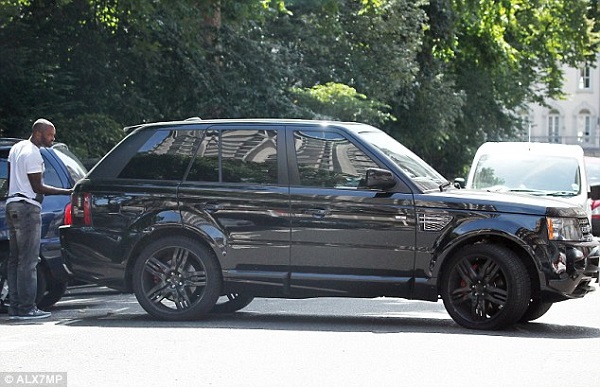 Darren Bent pictured in 2011 beside the luxury Range Rover stolen from his home at the weekend