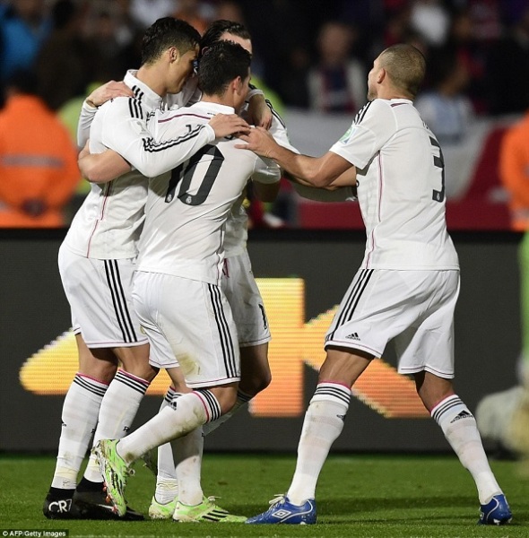 Gareth Bale is greeted by his team-mates Cristiano Ronaldo (left), James Rodriguez (centre) and Pepe after netting their second