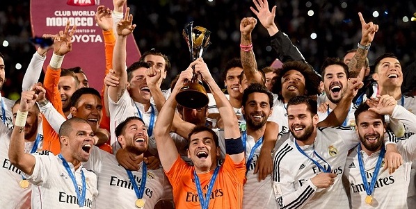 Real Madrid captain Iker Casillas (centre) lifts the FIFA Club World Cup trophy after they beat San Lorenzo 2-0