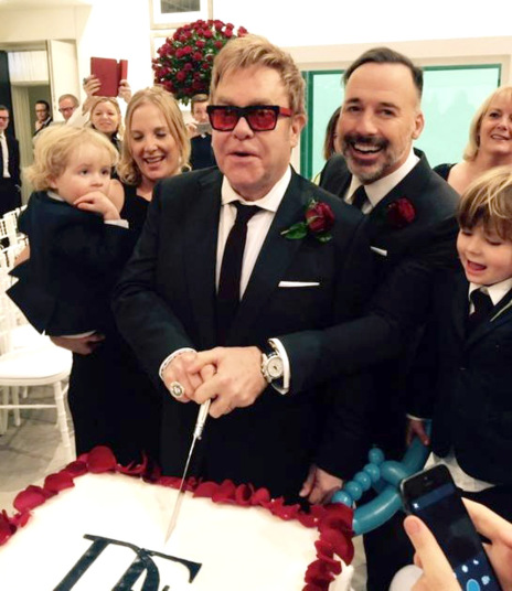 Sir Elton and David cut their cake