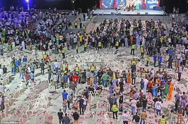 A riot breaks out at the Etihad Stadium during the final of the the annual invitational darts tournament