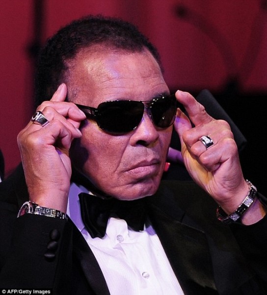 Ali, pictured in March 2012, adjusts his glasses on stage at Muhammad Ali's Celebrity Fight Night XVIII