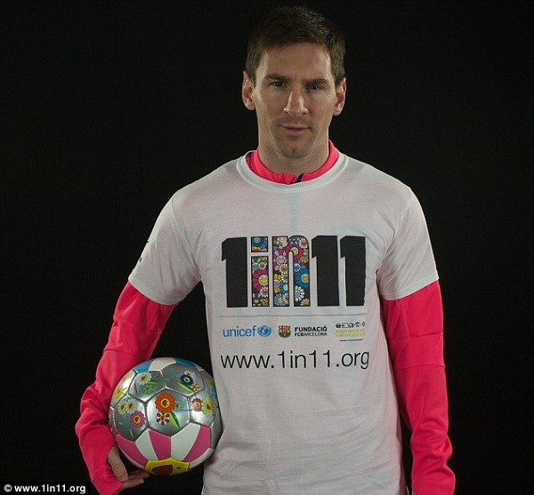 Barcelona star Lionel Messi, who is a UNICEF Goodwill Ambassador, poses in his 1 in 11 shirt