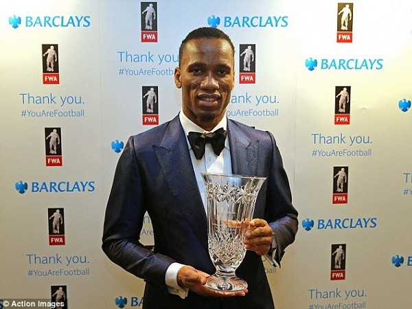 Chelsea striker Didier Drogba poses with his award at the Football Writers' Association Gala Tribute evening