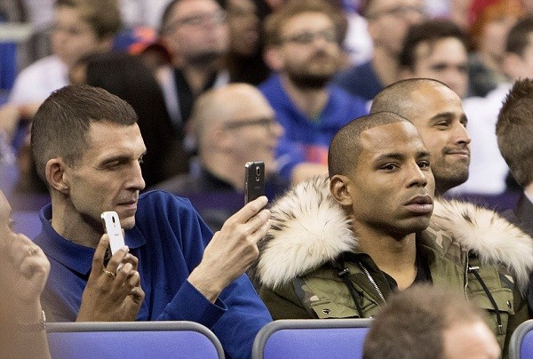 Crystal Palace midfielder Jason Puncheon (right) sits next to DJ Tim Westwood as he takes a picture with his phone