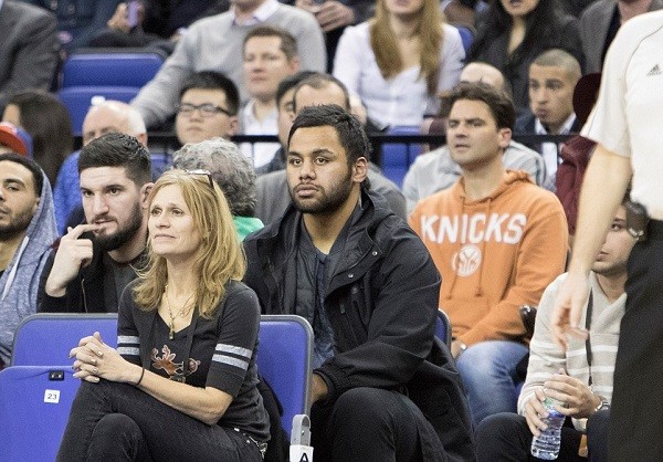 England rugby star Billy Vunipola watches intently from the sidelines as the Bucks run away with the game
