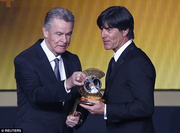 Joachim Low (right) receives the Coach of the Year award from Ottmar Hitzfeld at the Ballon d'Or awards