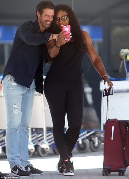 Say cheese! Serena Williams and Patrick Mouratoglou pose for selfies as they arrive at Perth International Airport ahead of the Hopman Cup