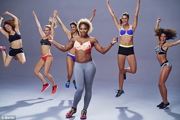Serena wears a pair of full-length grey sports leggings and pretty orange bra as she clicks her fingers and shows off her impressive arm muscles