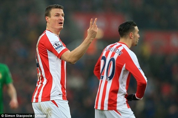 Stoke City centre back Robert Huth has been banned for two games following his Twitter comments