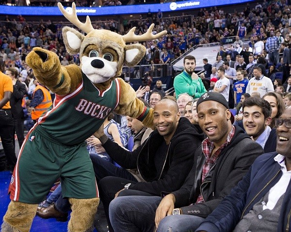 The Bucks mascot brings a smile back on Henry's face, the Frenchman received an ovation when his image was shown on the big screen