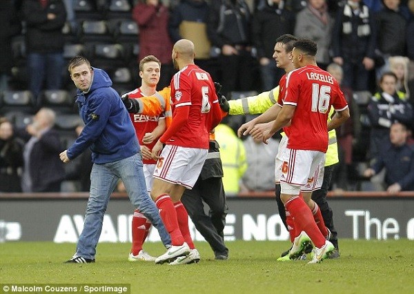 The Derby fan swung a punch at Nottingham Forest defender Kelvin Wilson, who moved out out of the way