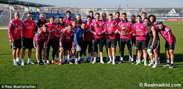 The entire Real Madrid squad pose with the award winners at the club's training ground on Tuesday