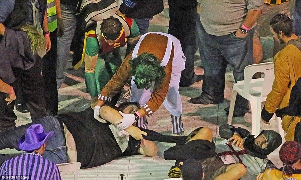 The rioting at the Etihad Stadium leads to some fans being injured, as others try to help them up