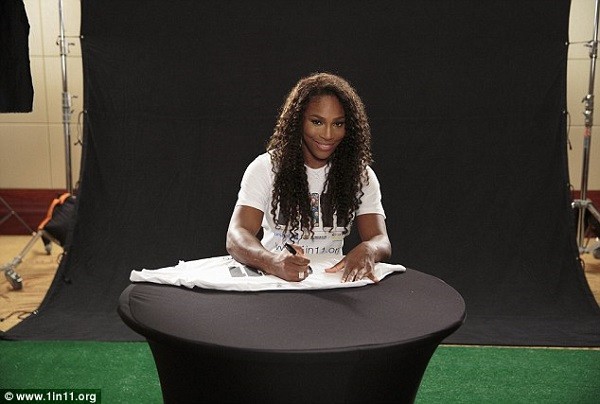US tennis star Williams signs a 1 in 11 shirt to be sold at auction in London