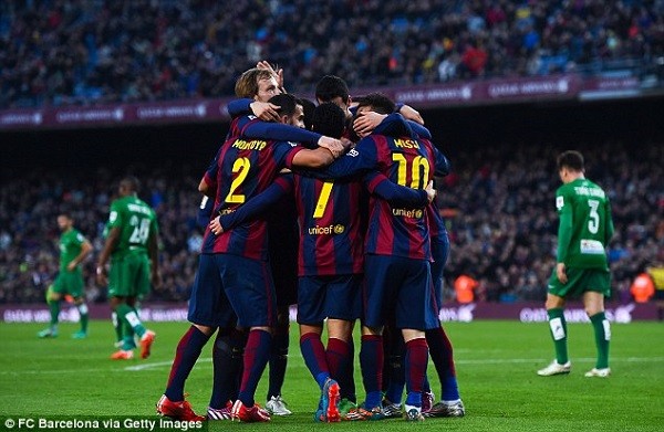 Barcelona celebrate after Messi scores his second goal after a neat passage of play involving Pedro
