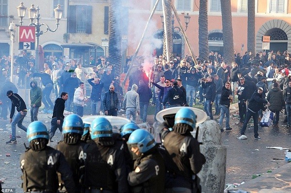Feyenoord fans have been involved in angry and bloody clashes in Rome ahead of their Europa League tie with AS Roma