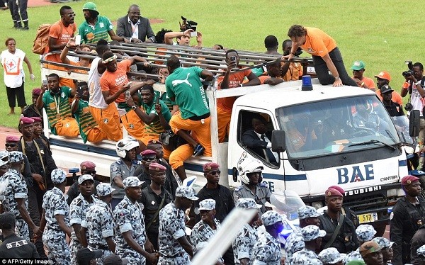 Ivory Coast players take part in a welcoming parade at Felix Houphouet Boigny Stadium in Abidjan on Monday