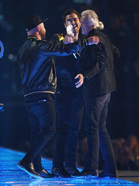 Jimmy Page presents Mike Kerr and Ben Thatcher of Royal Blood with the award for Best British Group
