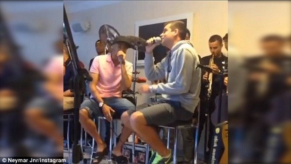 Neymar (left) uploaded an Instagram post on Thursday of himself signing with a friend and a full band. Photo: Instagram