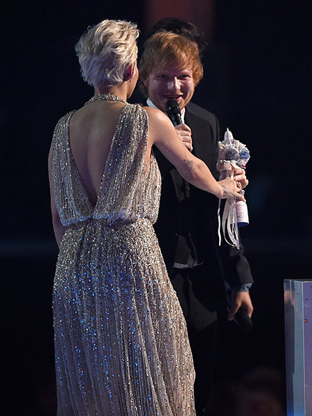 Orlando Bloom and Rita Ora present Ed Sheeran with the British Male Solo Artist Award