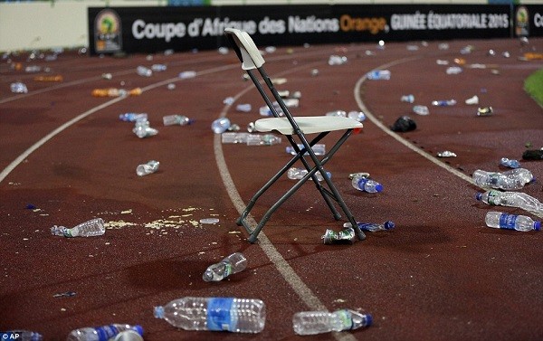 Plastic bottles and other debris litter the running track at the Malabo Stadium following the crowd disturbances