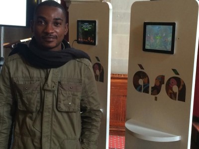 Adebayo Adegbemo, Nigeria's representative at the Futr Lab component of FuturEverything Festival, standing in front of his invention.